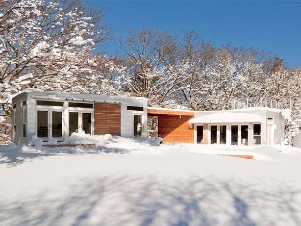 Blu Homes Origin prefab home in winter with snow.