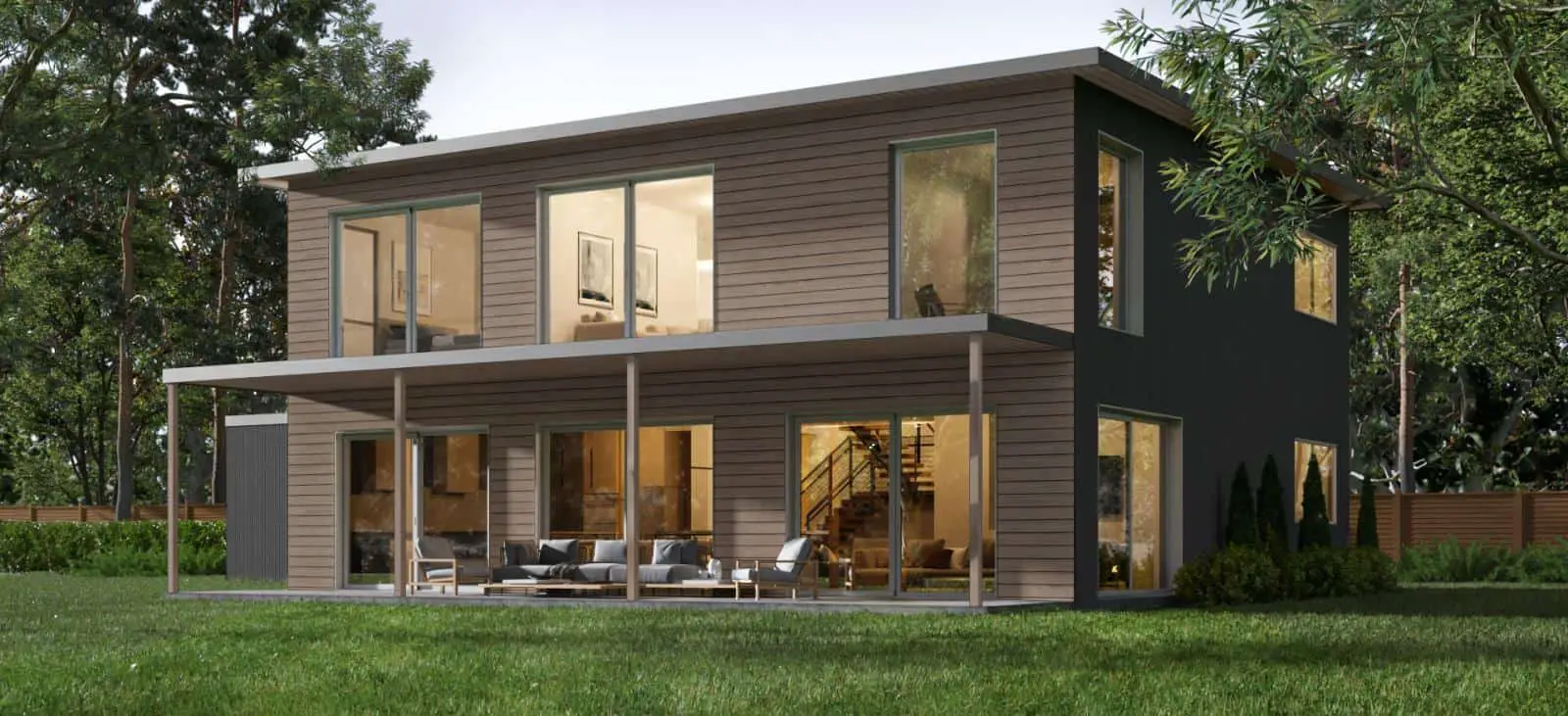 Trinity modern prefab home by Dvele rear exterior showing full-length covered deck and balcony.
