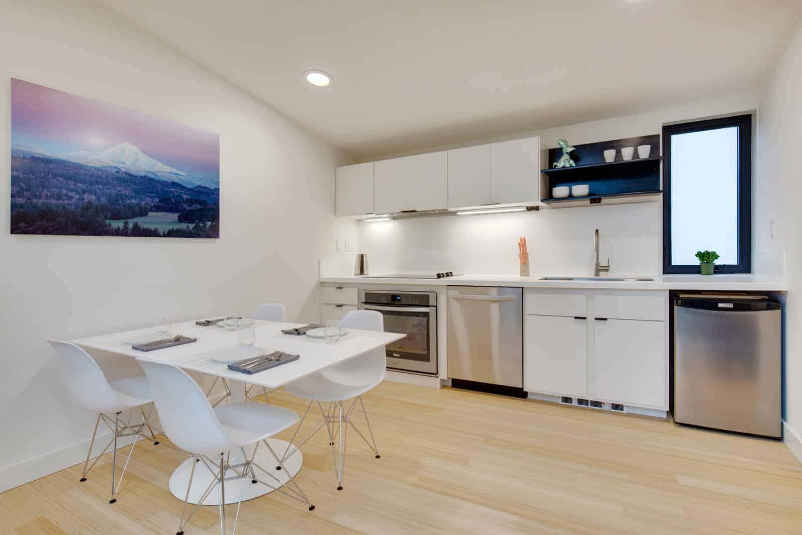 NODE Trilium modern prefab home interior - dining and kitchen.