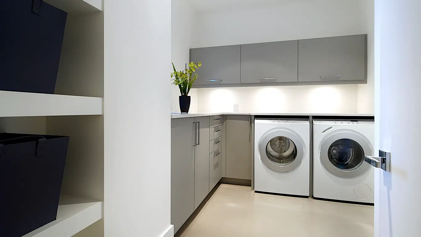 Dvele modern prefab home modern laundry and storage area.